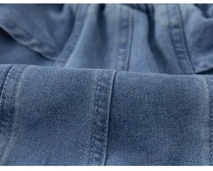 Macro shot of durable blue denim fabric texture with classic twill weaving detail