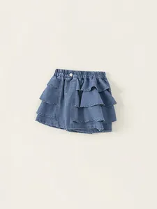 Girls layered blue denim ruffle skirt with elastic waistband and silver button detail