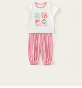 Detail of white cotton T-shirt with cartoon girl print and pink joggers for kids
