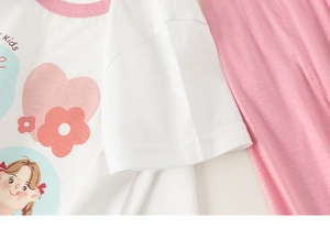 Detail of soft cotton kids T-shirt with pink collar and cute cartoon girl print