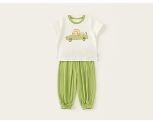 Detail of baby cotton summer set featuring fox print t-shirt and green casual pants