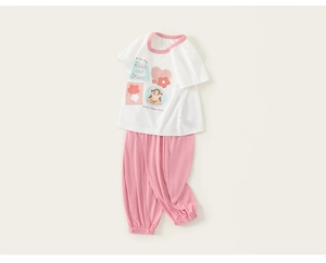 Detail of girls' white cartoon T-shirt and pink jogger pants set for summer home wear
