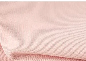 Close-up of pink ribbed knit fabric texture with soft elastic vertical stripe pattern