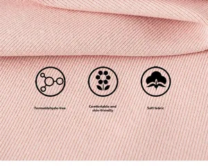 Detail of pink ribbed knit fabric showing soft texture and skin-friendly material