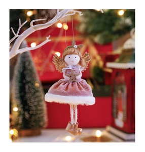 Pink velvet angel doll ornament with gold wings and star on a festive winter branch