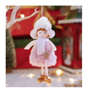 Detail view of plush Christmas angel doll with pink knit hat and golden boots on a tree