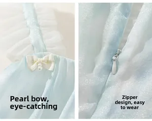 Détail de robe en tulle bleu clair avec bretelles à nœud perlé et zip invisible