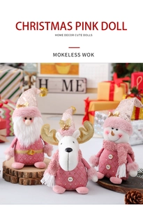 Dettaglio delle bambole di Natale rosa e oro con paillettes e texture di peluche