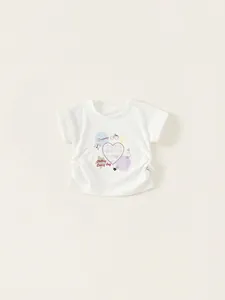 T-shirt fille en coton blanc avec motif cœur et détails de cordons de serrage latéraux