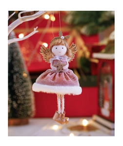 Close-up of a plush pink angel ornament with gold wings on a white branch decoration