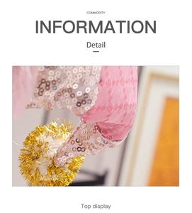 Detail shot of pink sequin fabric and glitter ornament on a festive plush doll