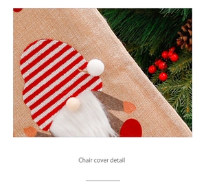 Close-up of rustic linen Christmas chair cover with plush gnome and knit hat detail