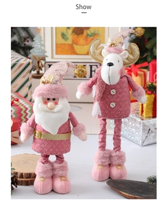 Detail of pink plaid fabric and sparkling sequins on plush Christmas figurines