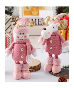 Detail of pink plush Christmas gnome and reindeer dolls with golden sequins and fur