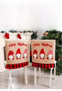 Detail of Christmas chair cover with gnome embroidery and red buffalo plaid ruffle hem