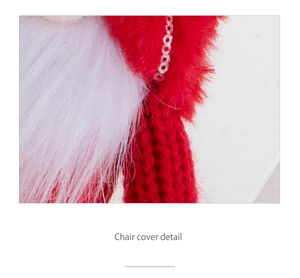 Close-up detail of red knit Christmas chair cover with white faux fur and red sequins