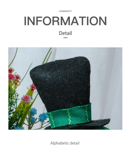 Detail of a black felt mini hat with green ribbon for festive window decorations