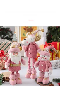 Close-up of extendable pink plush Christmas dolls with sequins and golden reindeer antlers