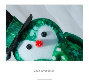 Close-up of green St. Patrick's Day chair cover with clover patterns and lucky elf hat
