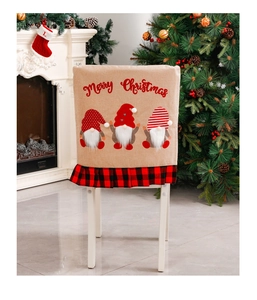 Detail of burlap Christmas chair cover featuring gnomes and red black buffalo plaid trim