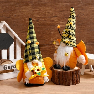 Charming bee gnomes with sunflower and honey wand accessories on rustic wood background