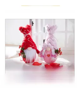 Close-up of illuminated Valentine's Day gnomes with silver sequins and heart detail