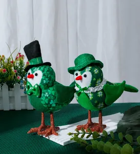Detail of green bird figurines with shamrock patterns for St. Patrick's Day decor