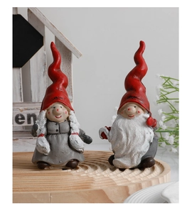 Close-up of resin Christmas gnomes with sparkling glitter on hats and beards