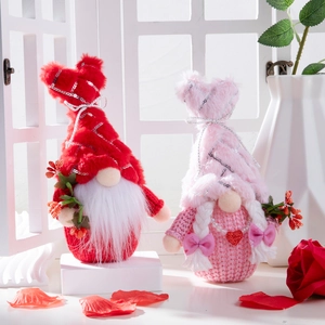 Pair of glowing Valentine's Day gnomes with sequins and roses for home decor