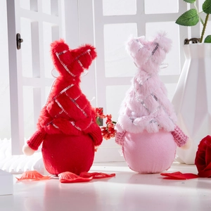 Gnome plush dolls with red pink sequin hats for Valentine's Day decor with roses
