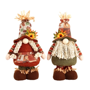 Pair of telescopic harvest scarecrow gnomes with sunflowers and autumn leaf decorations