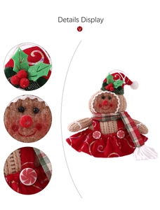 Detail showing gingerbread girl doll with red felt skirt and candy button decor