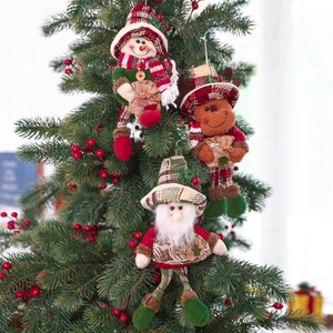 Plush Christmas gnome dolls with long legs hanging on a festive tree branch decoration