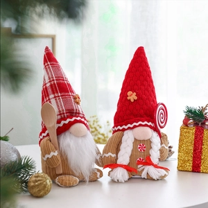 Detail of Christmas gingerbread gnomes featuring velvet bodies and knitted hats with wooden spoons
