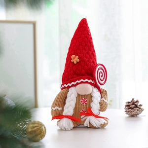 Detailed view of Christmas gnome plush with knitted red hat and gingerbread man accent