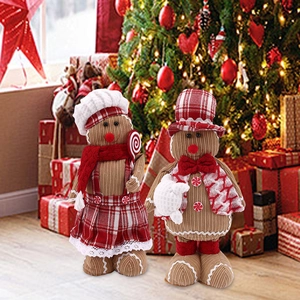 Close-up of gingerbread plush toys with chef hats in a cozy Christmas home setting