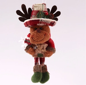 Detail of Christmas reindeer plush ornament with red plaid hat and festive greenery