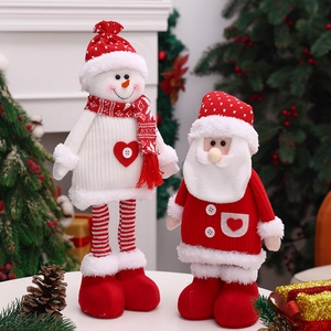 Detail of Christmas telescopic knitted plush dolls with snowman and Santa Claus designs