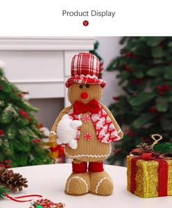 Close-up of a gingerbread man plush with corduroy texture and red Christmas accessories