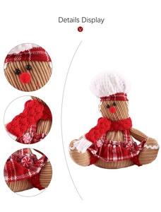 Detail display of glowing gingerbread man doll with chef hat and corduroy texture