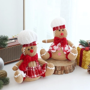 Close-up of gingerbread plush toys with chef hats and festive decorations for Christmas
