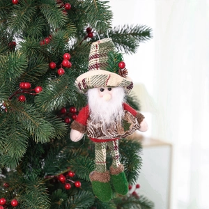 Handmade Christmas elf plush ornament with red green plaid hat hanging on festive tree
