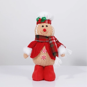 Detail of a Christmas gingerbread doll with red crochet sweater and mint candy buttons
