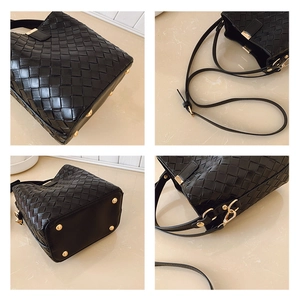Detailed views of black woven leather bucket bag with gold hardware and bottom studs