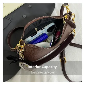 Top view of spacious interior with zipper pocket in brown pebble leather bag