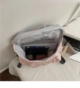 Interior view of large capacity pink backpack with laptop compartment and multi-layer storage