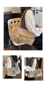 Macro view of cream suede tote bag with wide woven strap and drawstring detail