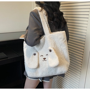 Detailed back view of a white plush rabbit tote bag showing texture and ear decorations