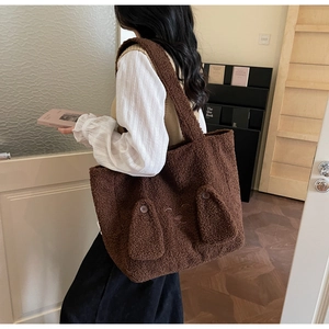 Detail of cute plush tote bag in dark brown with fuzzy texture and 3D animal ears design