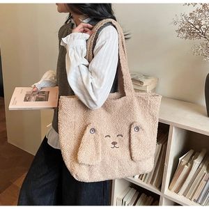 Detail of cute plush lamb wool tote bag featuring 3D cartoon animal ears and embroidery